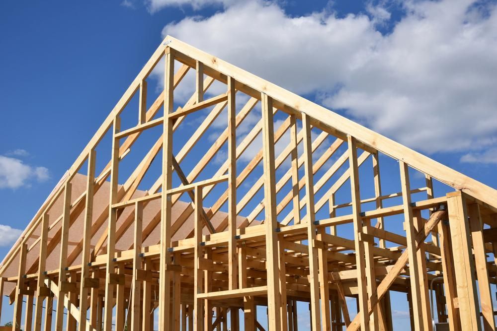 A House Is Being Built With A Blue Sky In The Background — Loretta Davison Financial Solutions In Shellharbour, NSW