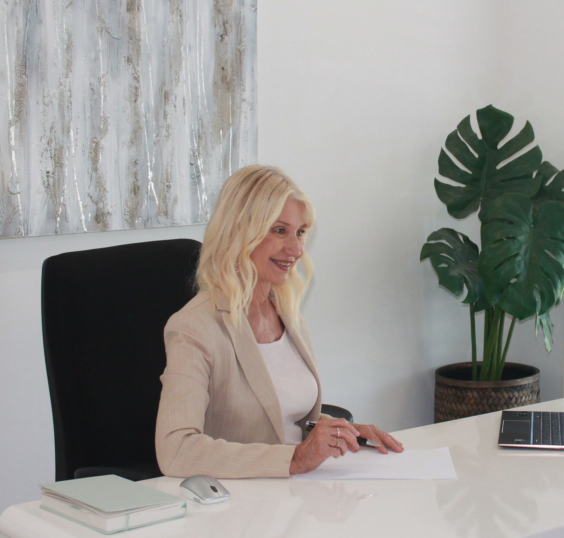 Woman Sitting At Office Desk — Loretta Davison Financial Solutions In Shellharbour, NSW 