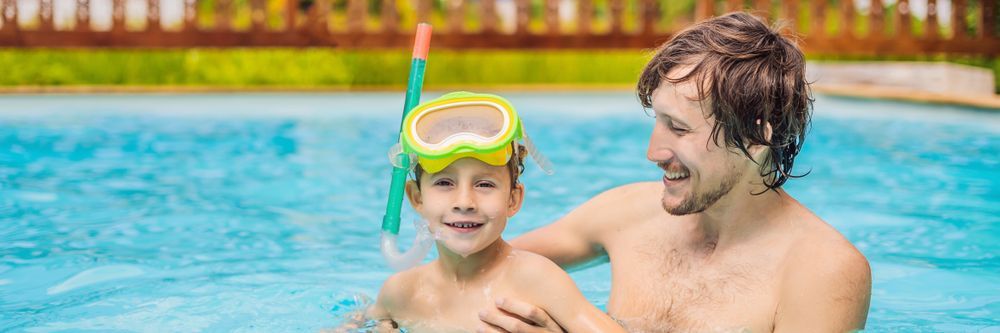 A Man and A Boy Are Playing in A Swimming Pool the Boy Is Wearing Goggles —
Whitsunday Pool Service in Cannonvale, QLD 