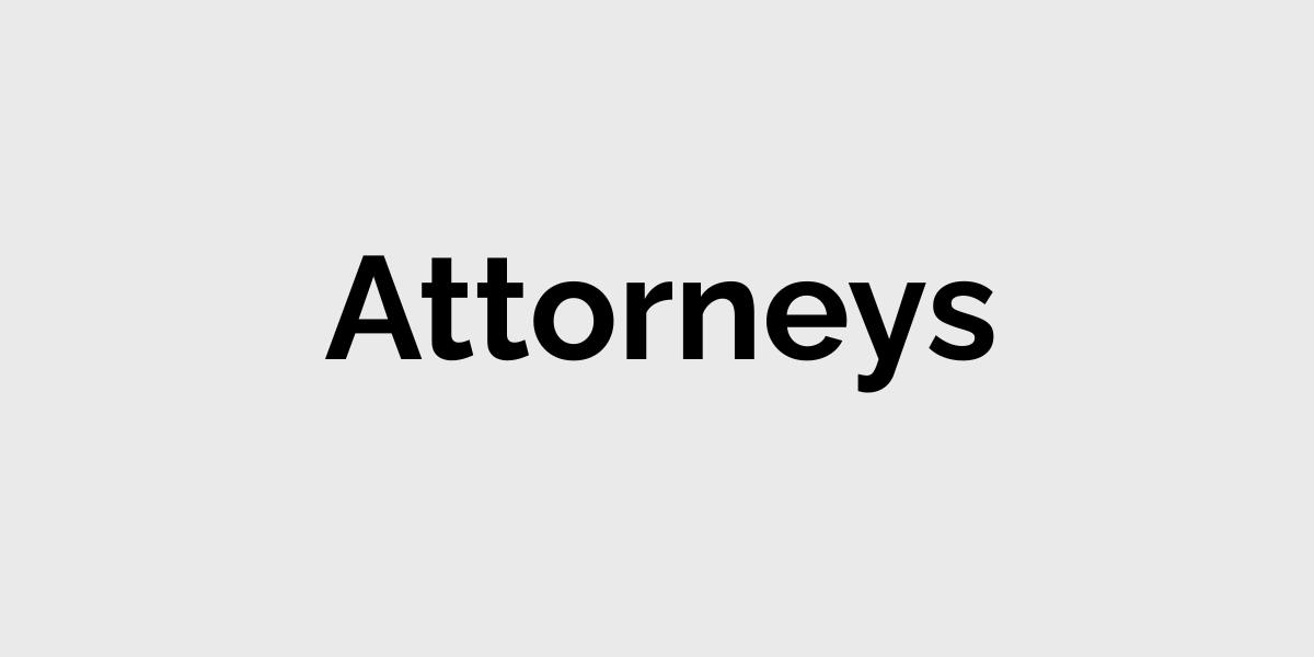 Black text reading “Attorneys” on a light gray background