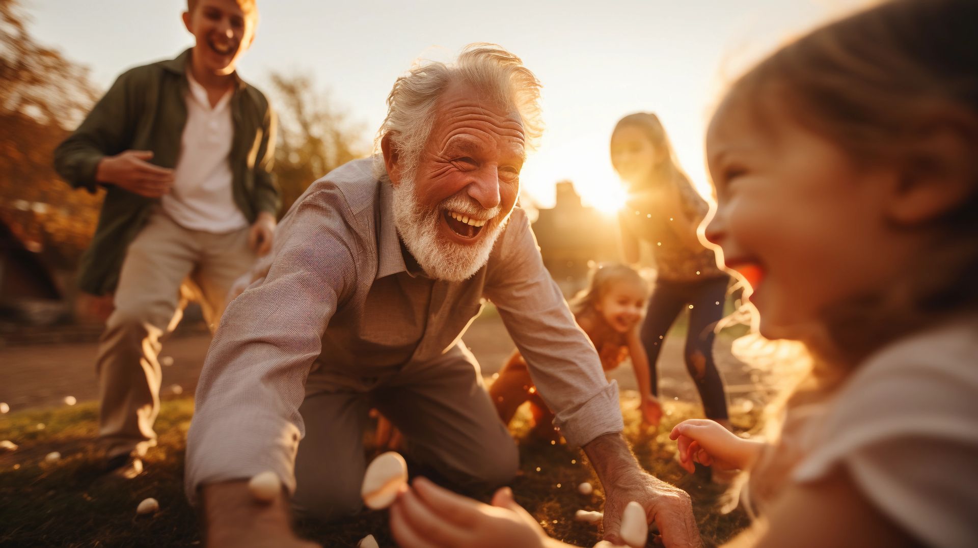 A group of people are playing with marshmallows in a park.