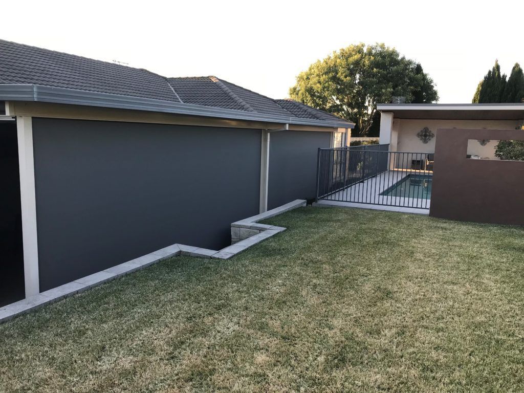 A House with A Fence and A Pool in The Backyard — Winning Blinds in Cardiff, NSW