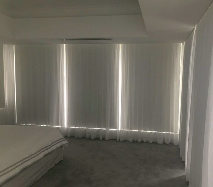 White Bedroom With Sheer Curtains — Winning Blinds in Cardiff, NSW