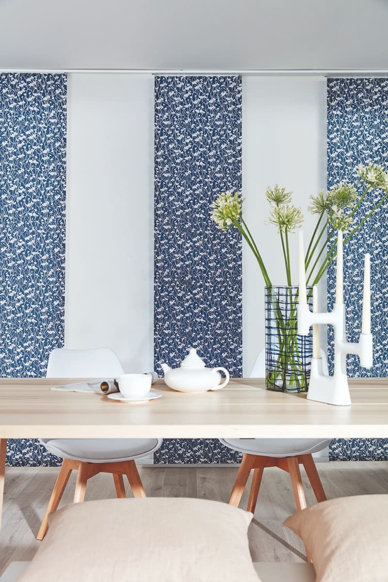 A Dining Room Table with A Vase of Flowers and Candles on It — Winning Blinds in Toronto, NSW