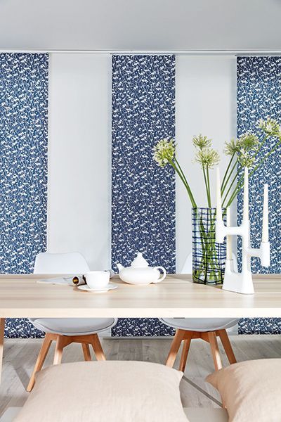 Dining Room With A Wooden Table, And Patterned Blinds — Winning Blinds in Cardiff, NSW