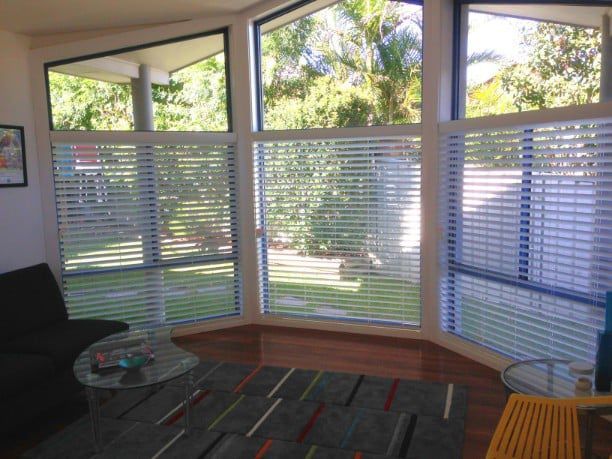 Living Room With Large Windows, Blinds, And Dark Rug — Winning Blinds in Cardiff, NSW