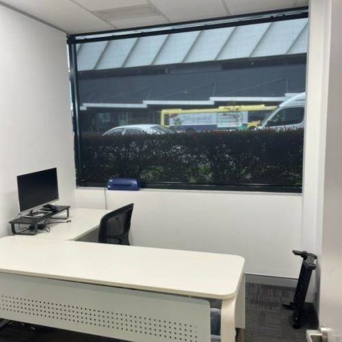A Small Office With a Desk and a Computer — Winning Blinds in Cardiff, NSW