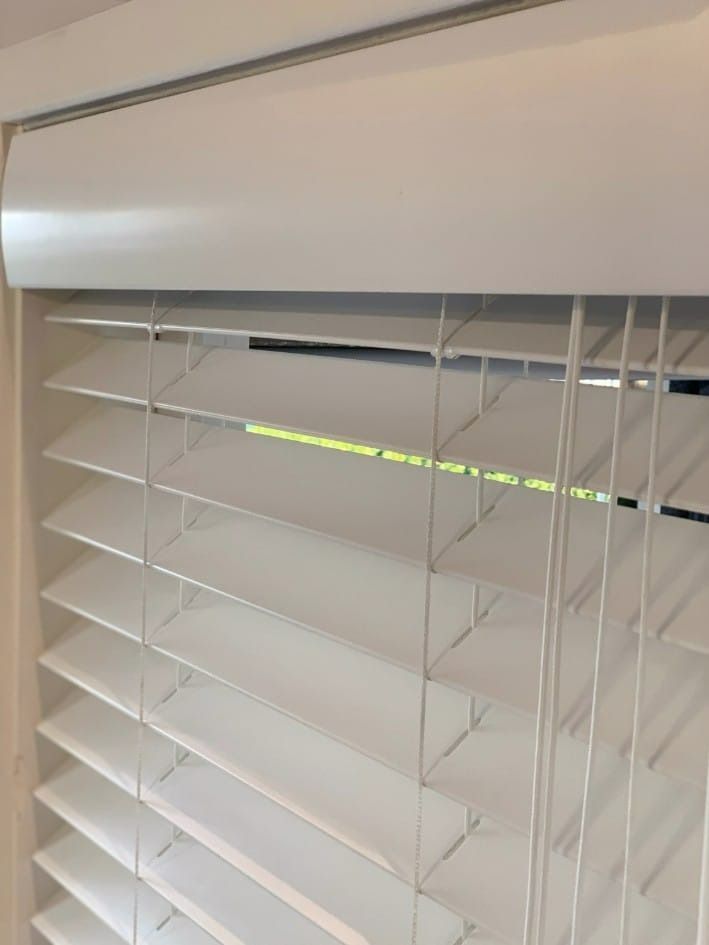 A close up of a white blind on a window — Winning Blinds in Cardiff, NSW