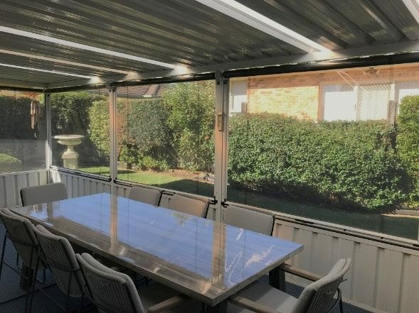 A House With a Black Awning on the Side of It — Winning Blinds in Cardiff, NSW