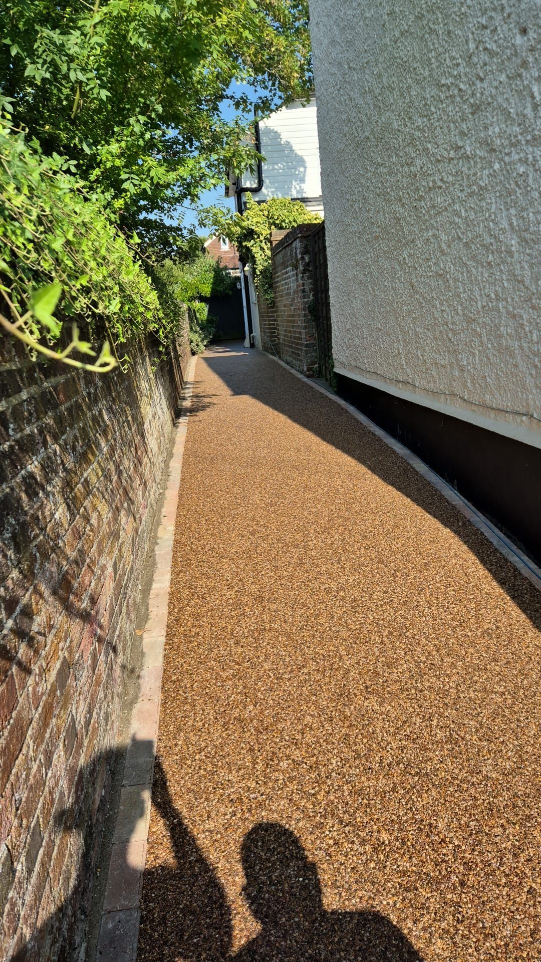 Newly installed gravel pathway in Woking, a neat access solution by Surrey Hills.