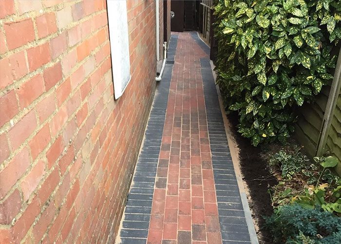 New block paved side path and garden border in Woking, installed by Surrey Hills.