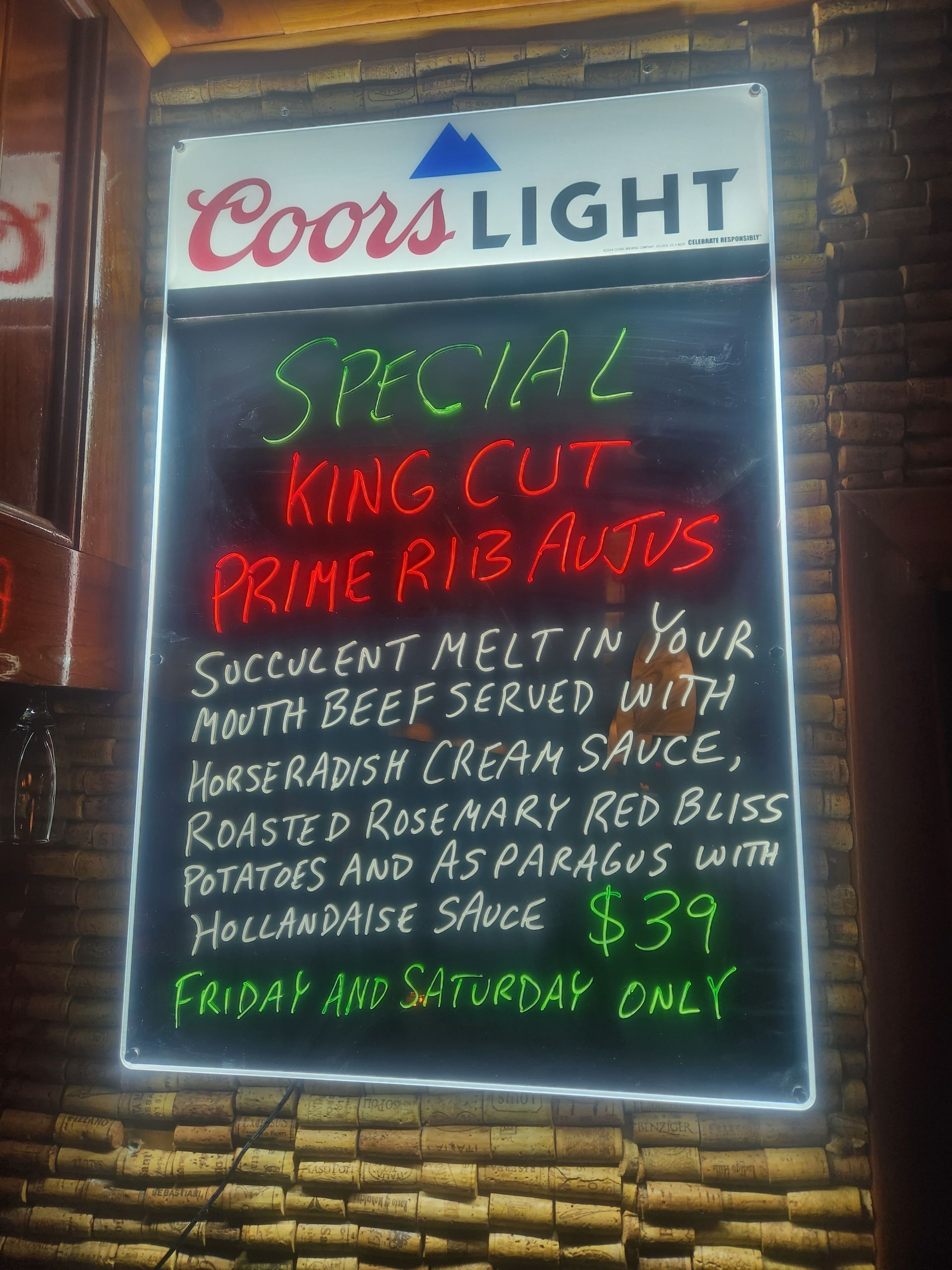 Coors Light neon sign advertising special king cut prime rib ribs with prices and side options