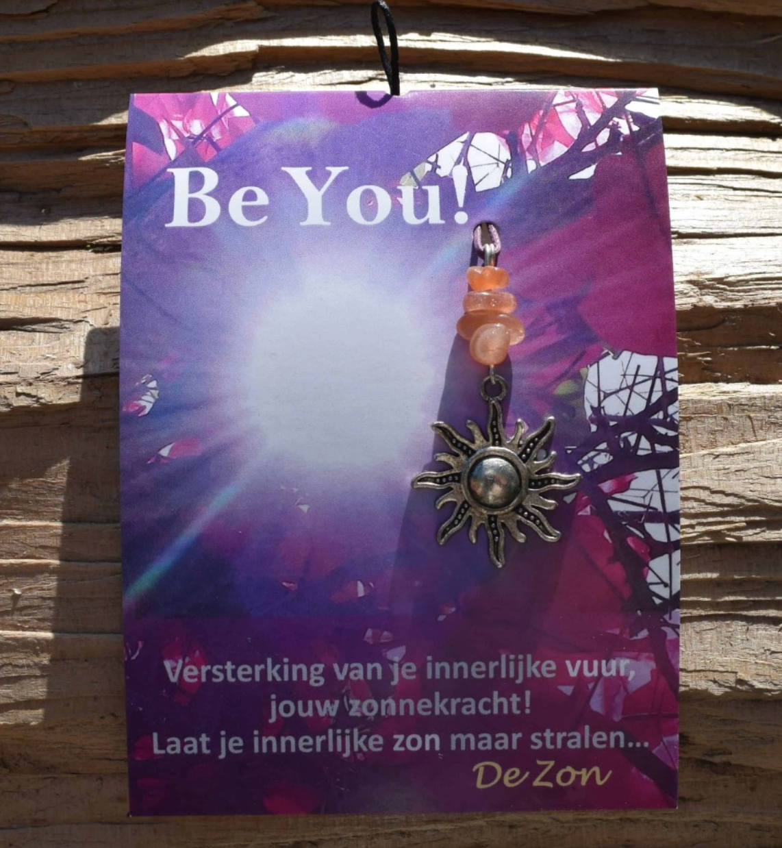 Kaart met zonnetje als bedeltje. Tekst: