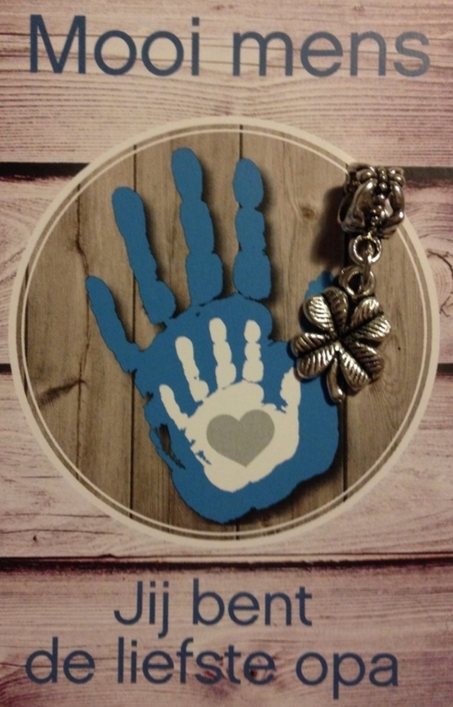 Blue handprint with heart, text reads