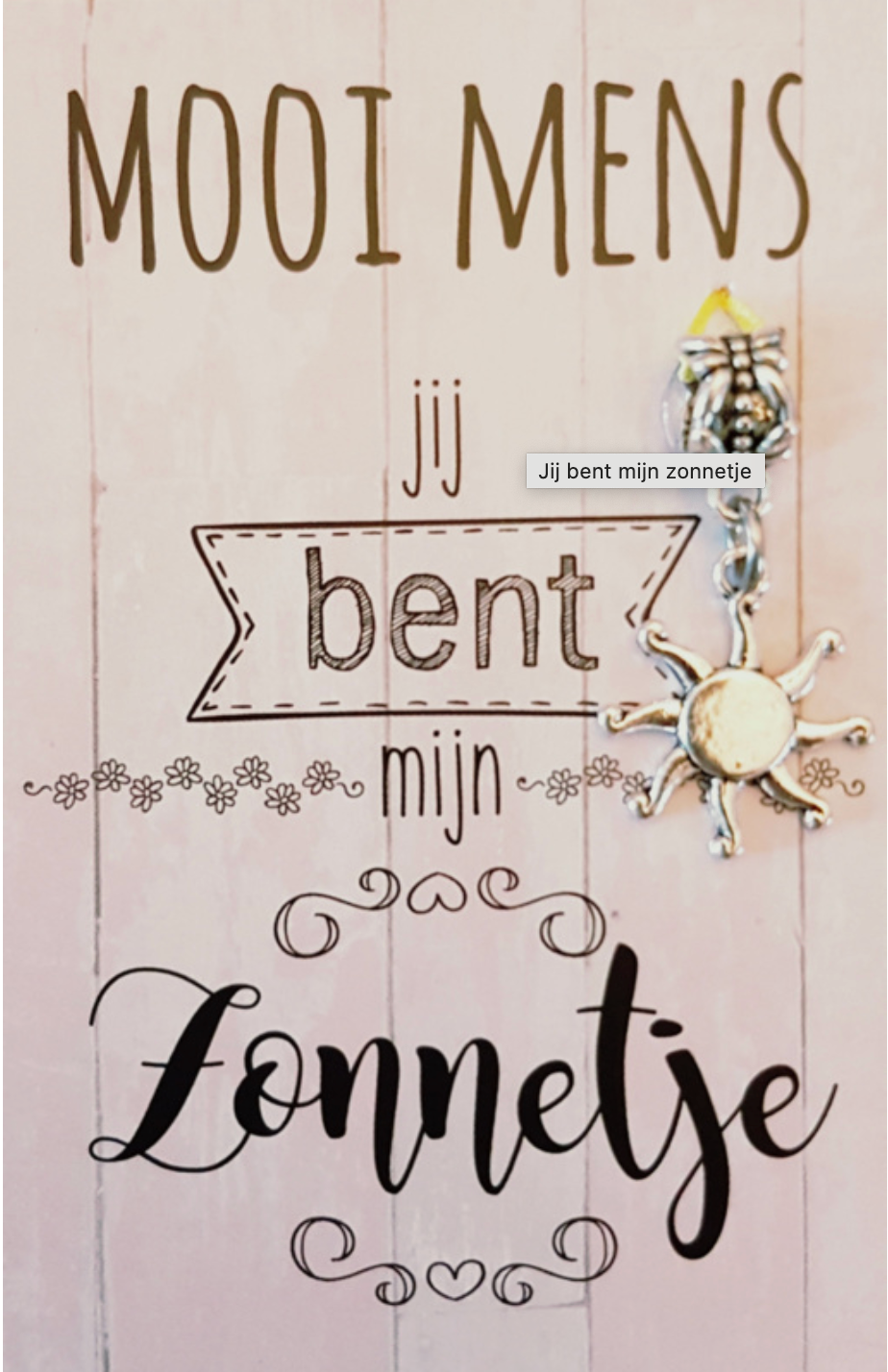Pink wooden sign with text: