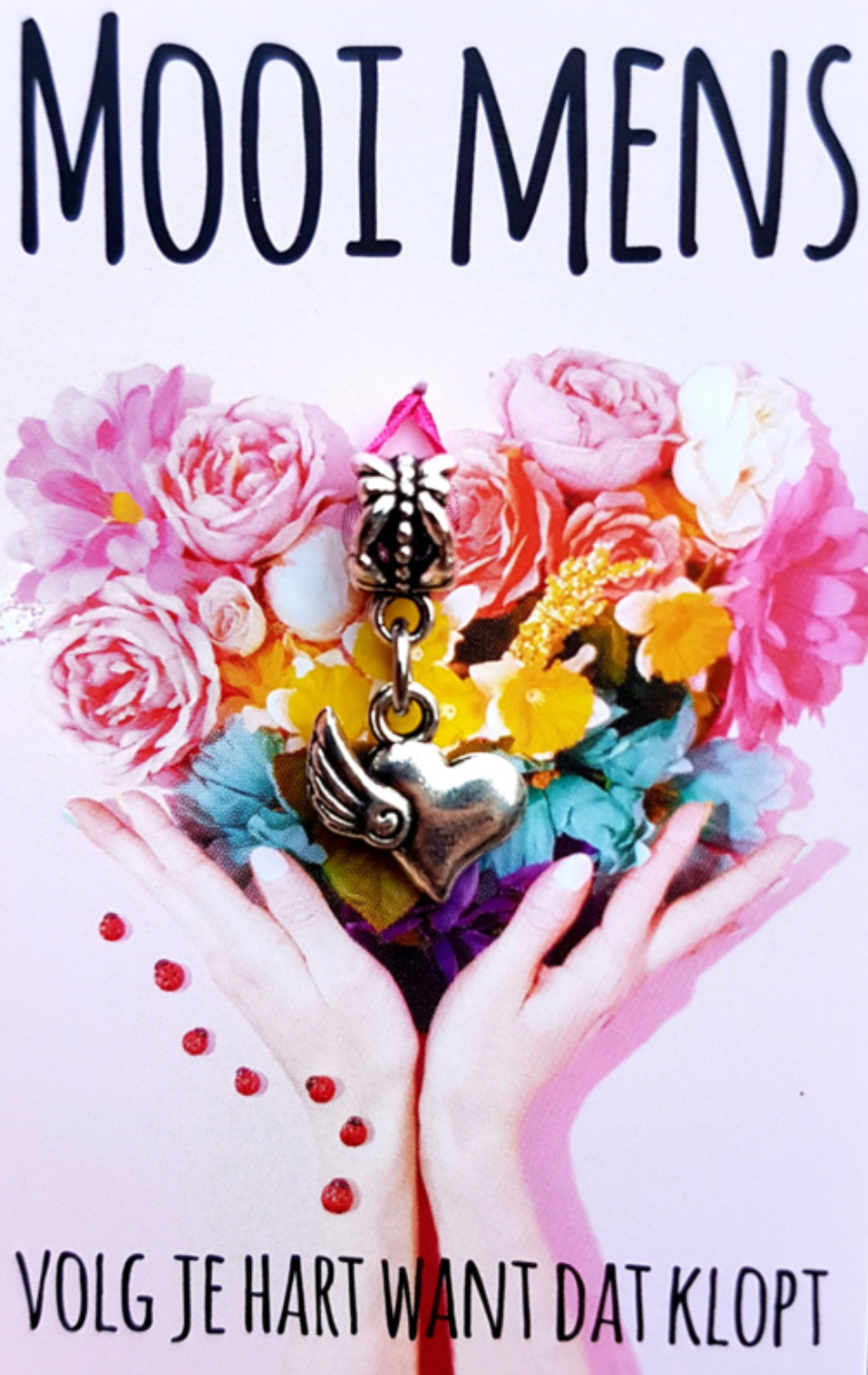 Hands holding a heart-shaped bouquet with a charm, text reads