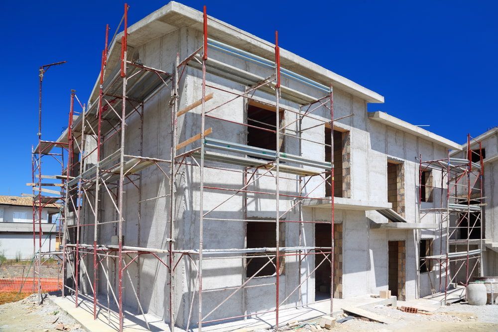 A House Is Being Built With Scaffolding Around It — Fahlstrom Scaffolding Cairns Pty Ltd in Tablelands, QLD