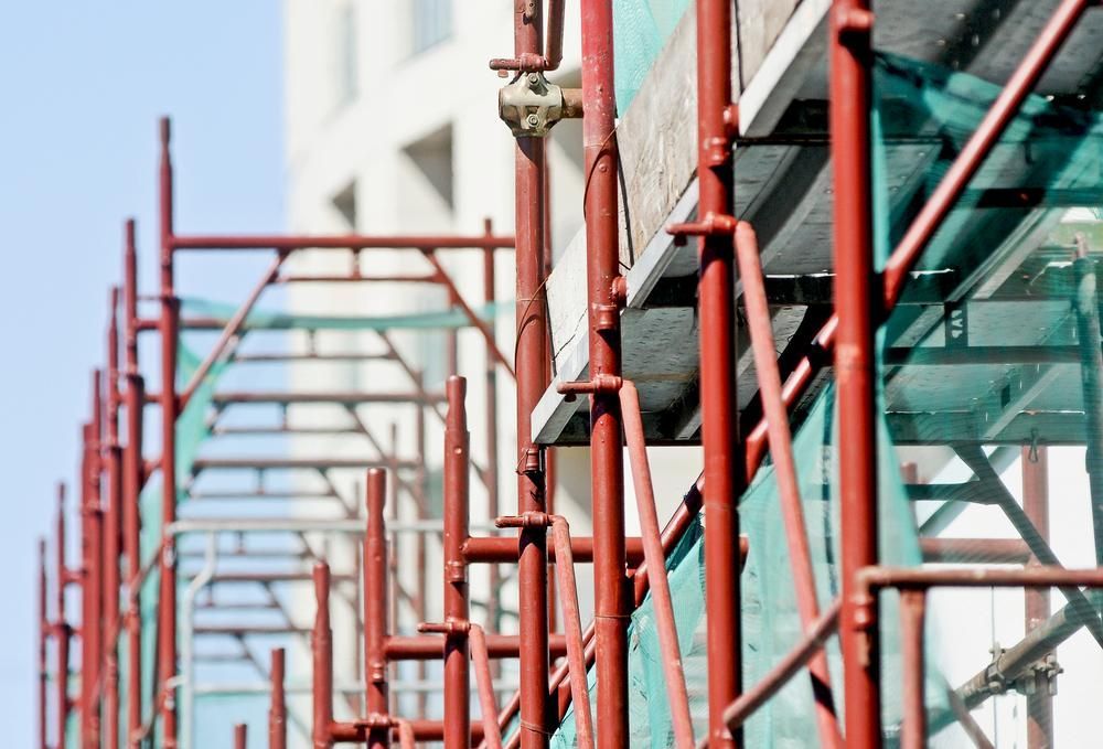 A Close Up Of A Metal Scaffolding On A Building Under Construction — Fahlstrom Scaffolding Cairns Pty Ltd in Gordonvale, QLD