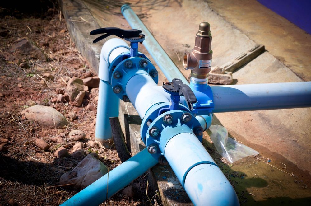 A Close Up of a Water Pipe With a Valve Attached to It — Stockers & Partridge In Pokolbin, NSW