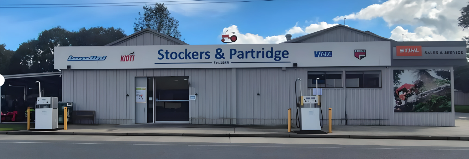 A Row of Lawn Mowers Are Lined Up in a Field — Stockers & Partridge In Paterson, NSW