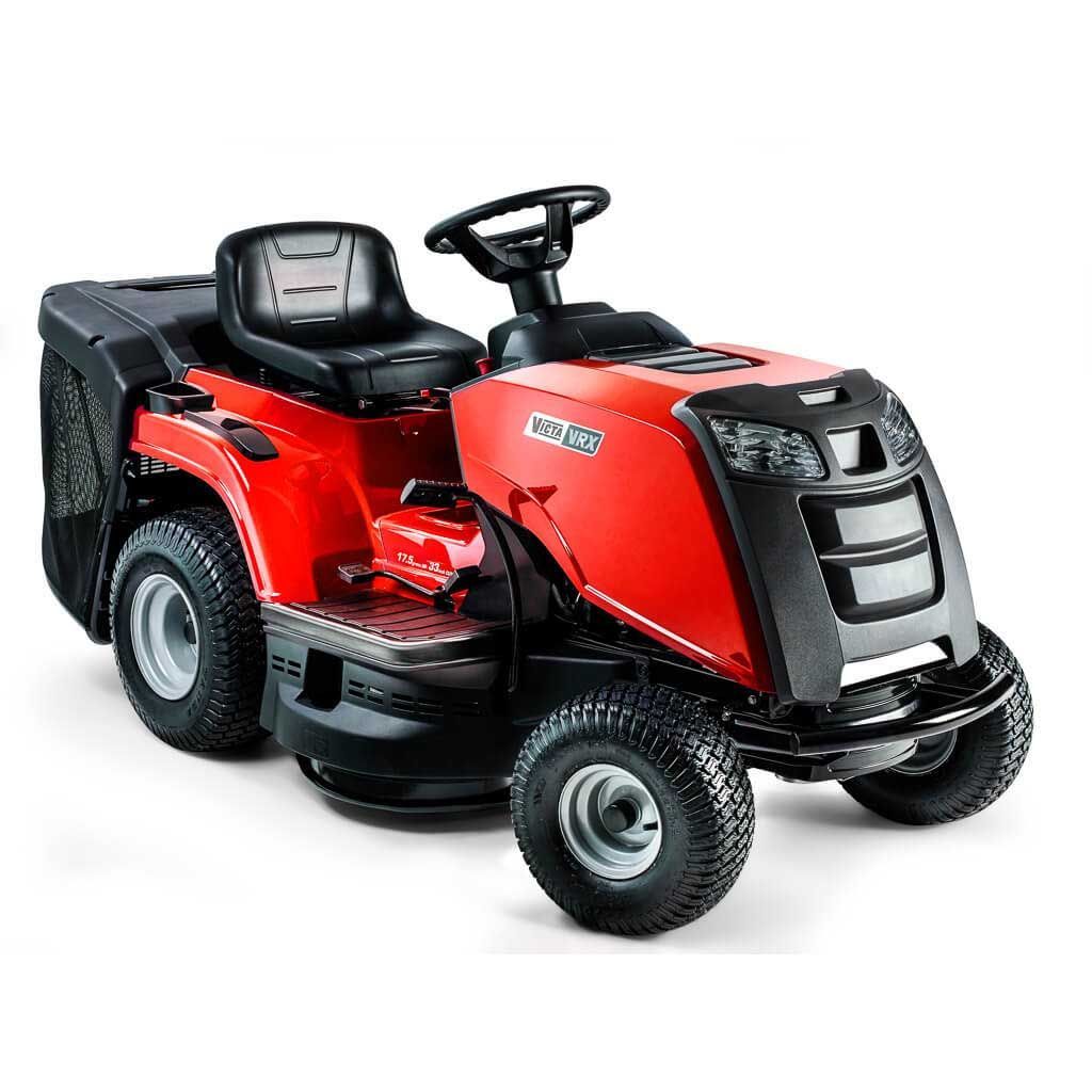 A Man is Riding a Lawn Mower on a Lush Green Lawn — Stockers & Partridge In Pokolbin, NSW