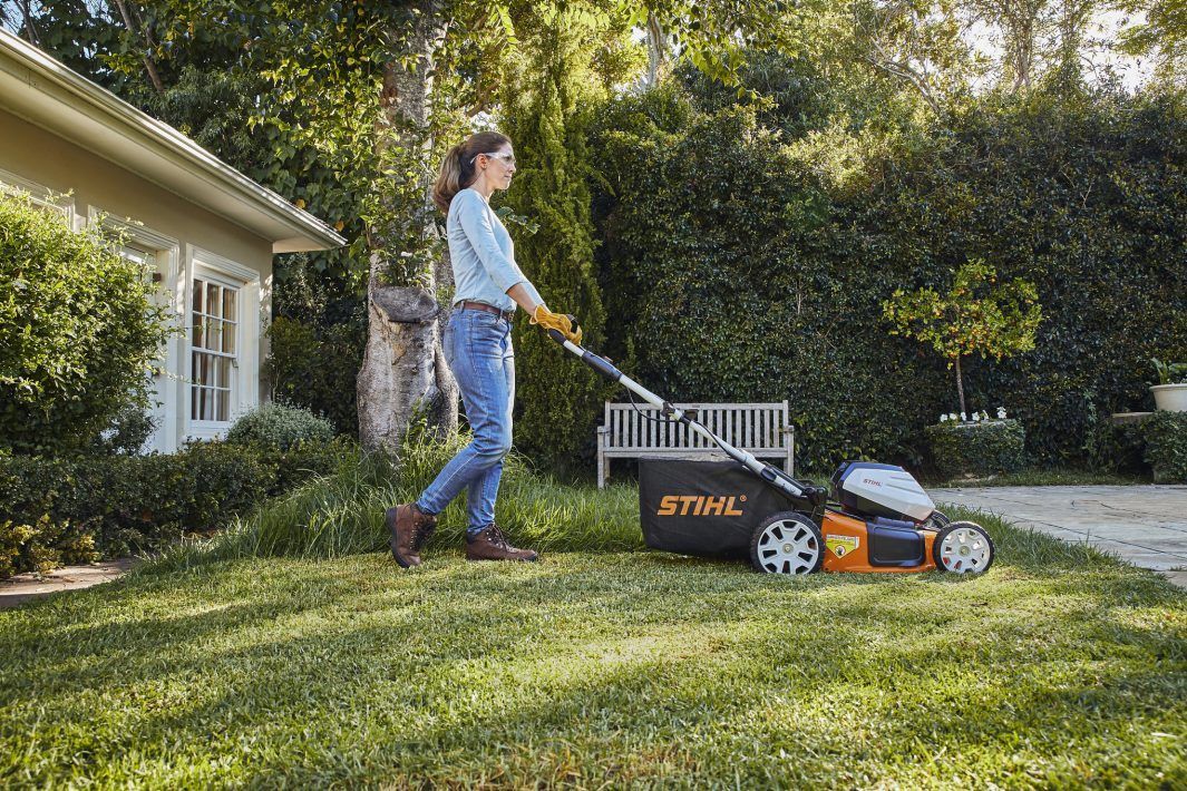 A Lawn Mower is Cutting a Lush Green Lawn — Stockers & Partridge In Paterson, NSW