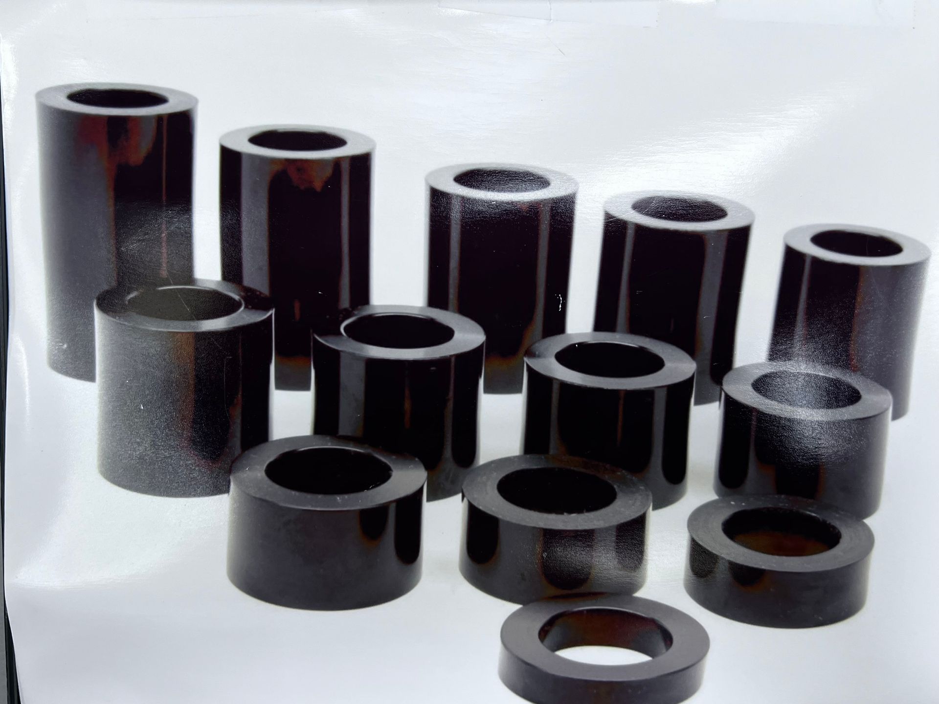 A bunch of black cylinders with holes in them