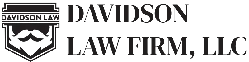 The logo for davidson law firm llc is black and white