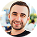 Smiling man in a white shirt on a plain background, shown as a small profile avatar