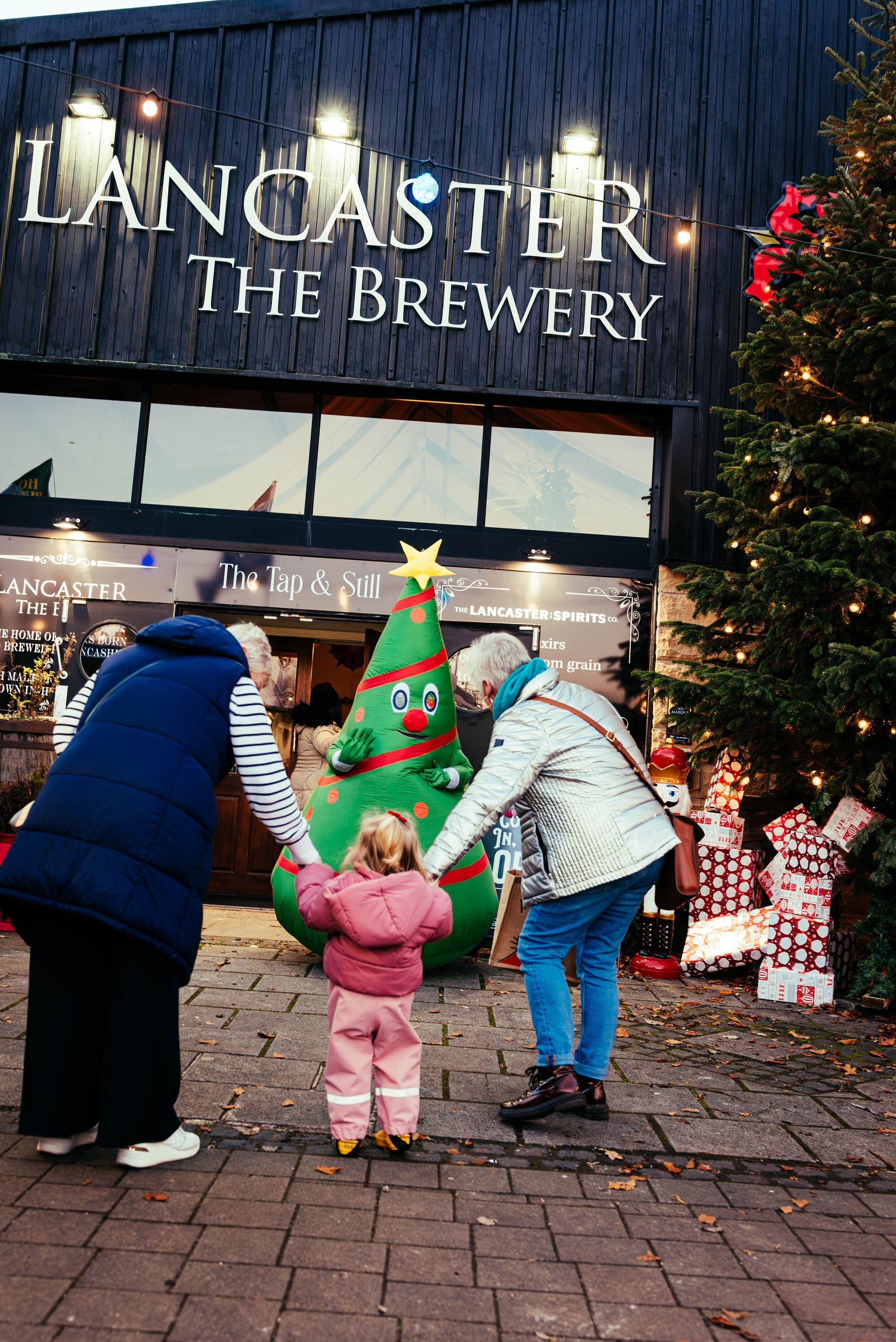 Families enjoying Lancaster Christmas Market in Lancashire