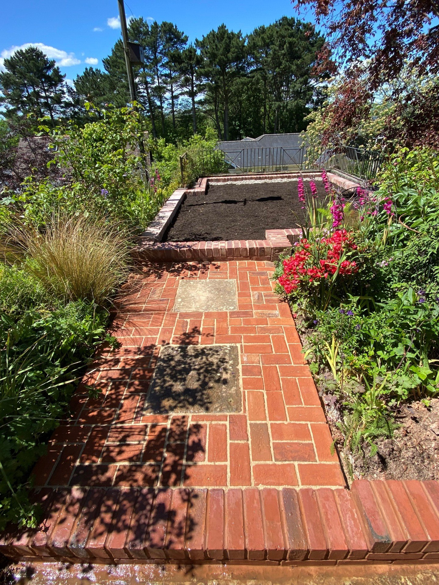 Photo showing a landscaped contemporary Japanese garden with a large expanse of pre-treated timber decking