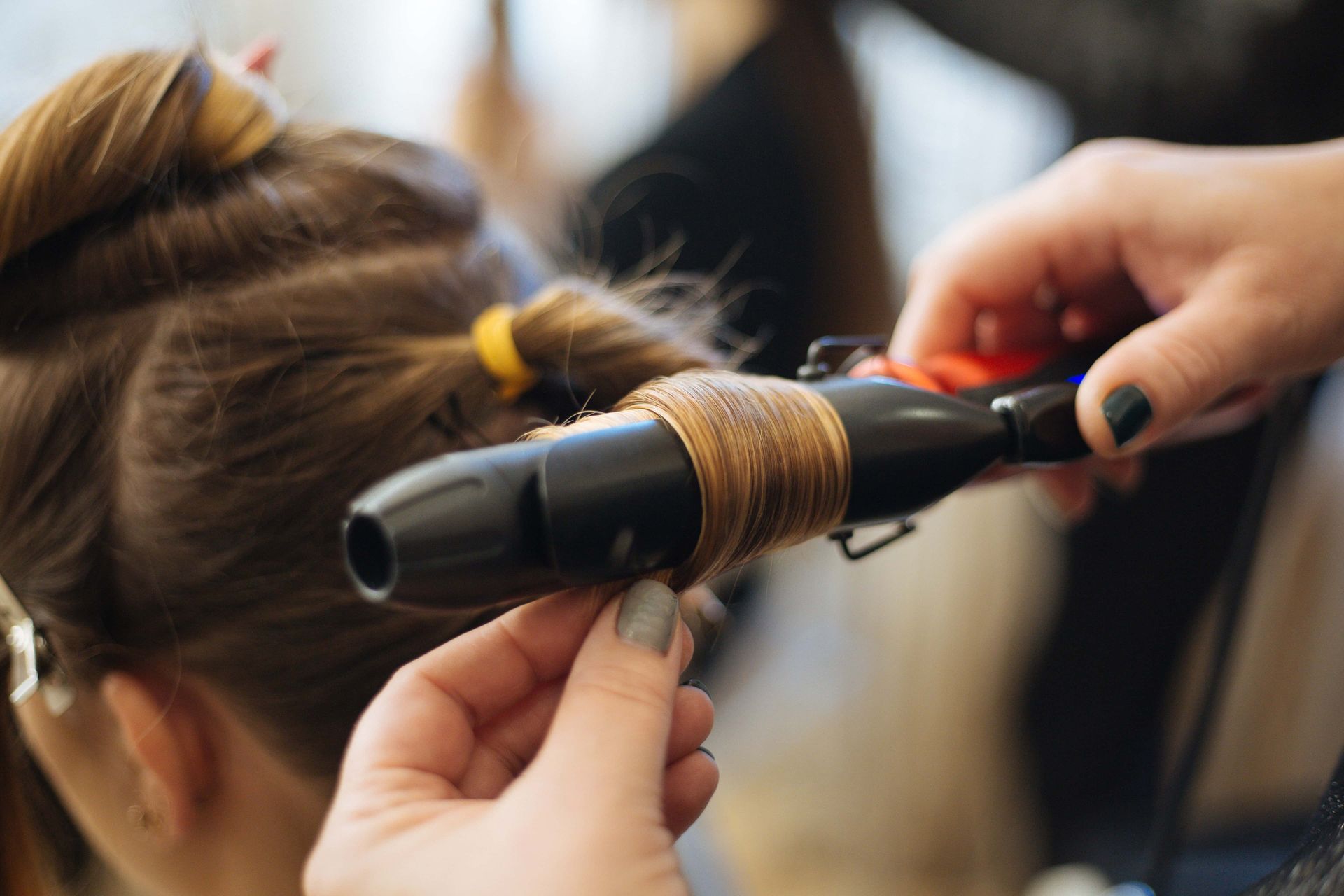 Hairdresser Does Hairstyle In Beauty Salon