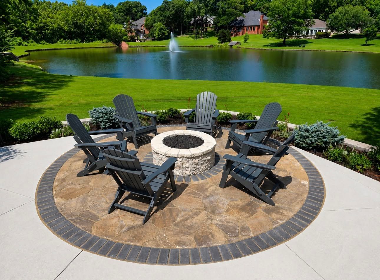 Backyard patio at dusk with fire pit, lounge chairs, and warm lights by a house