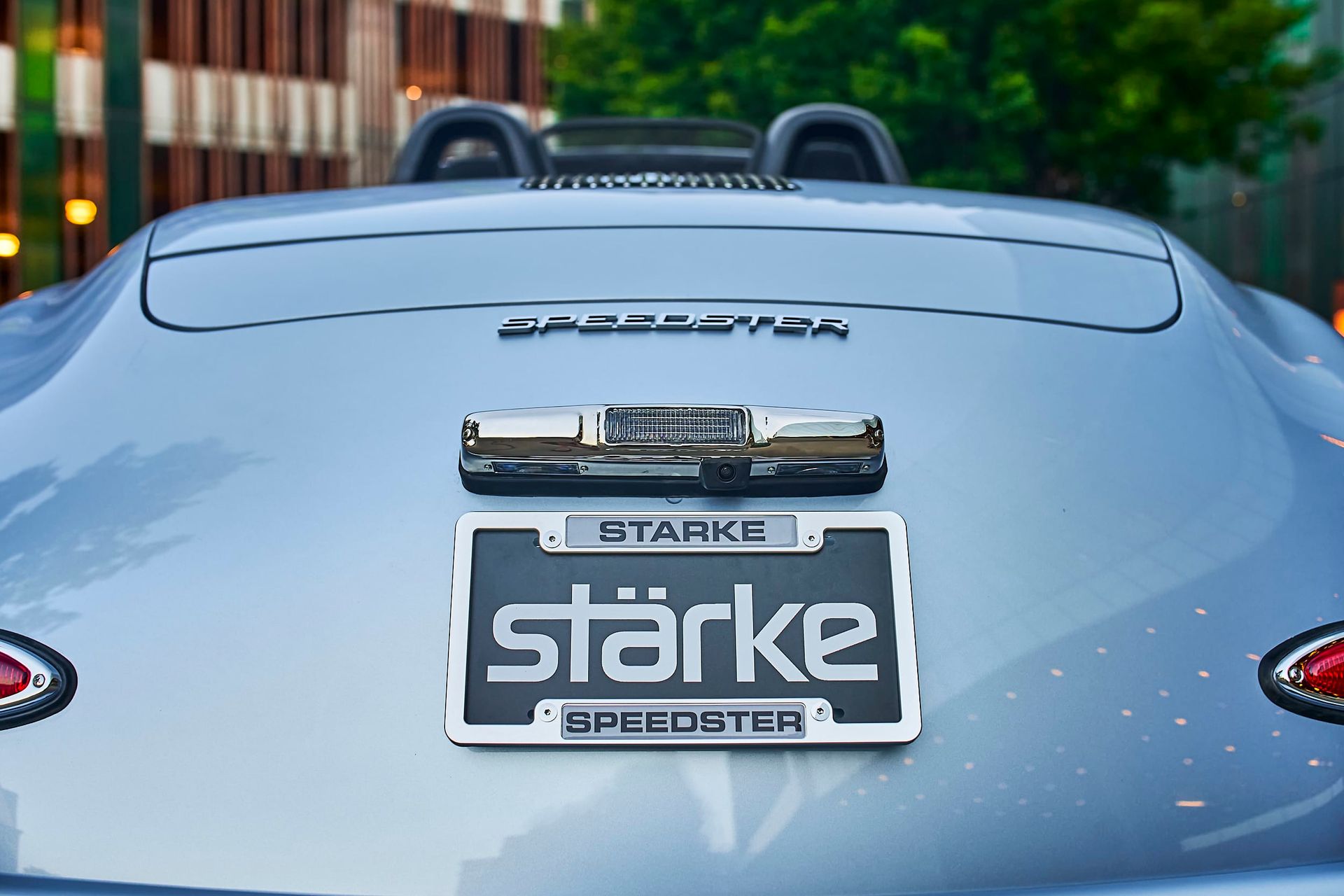 Rear view of a light blue Stärke Speedster. It has a license plate that says
