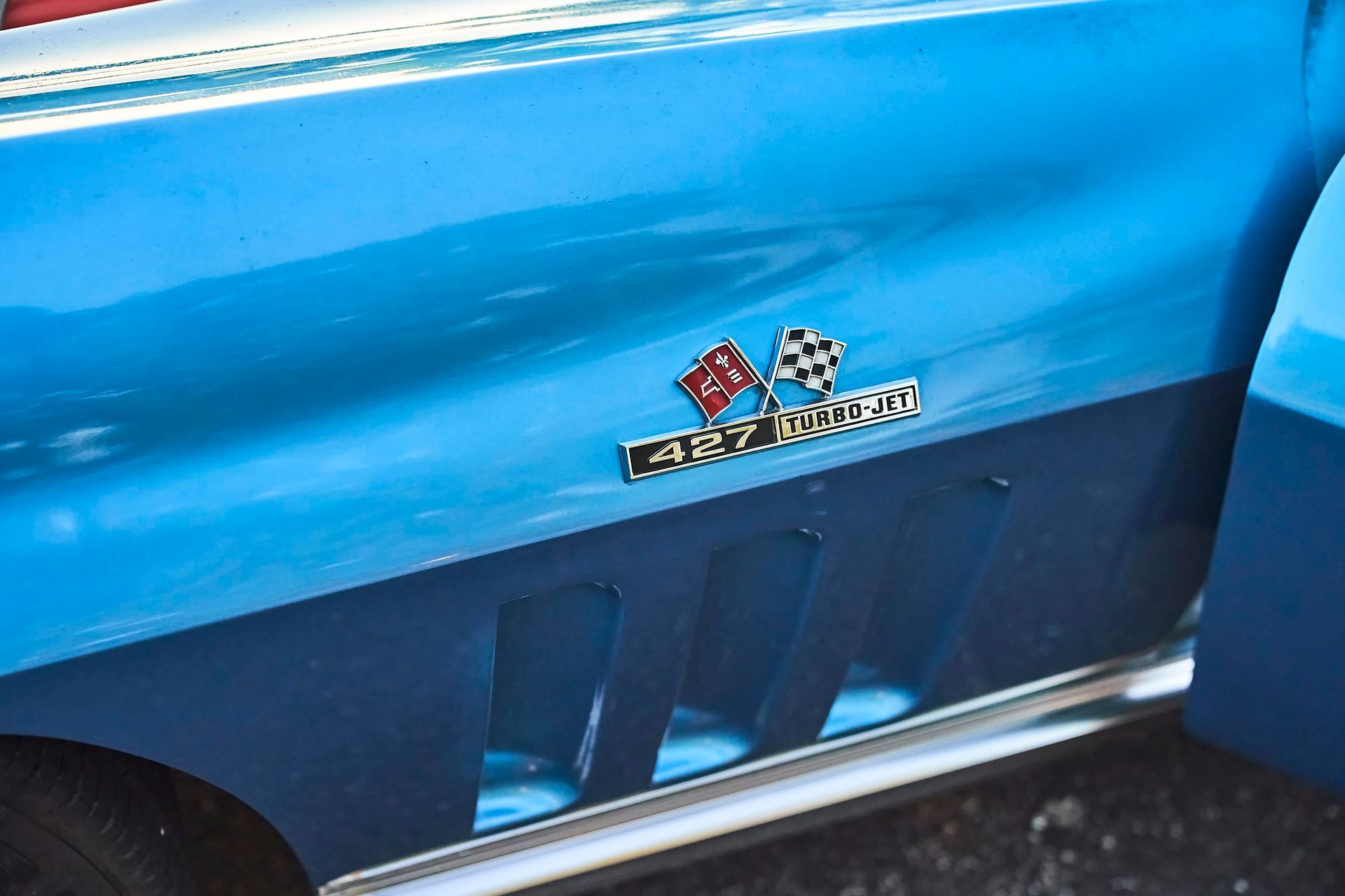 Close-up of a light blue classic car with a 