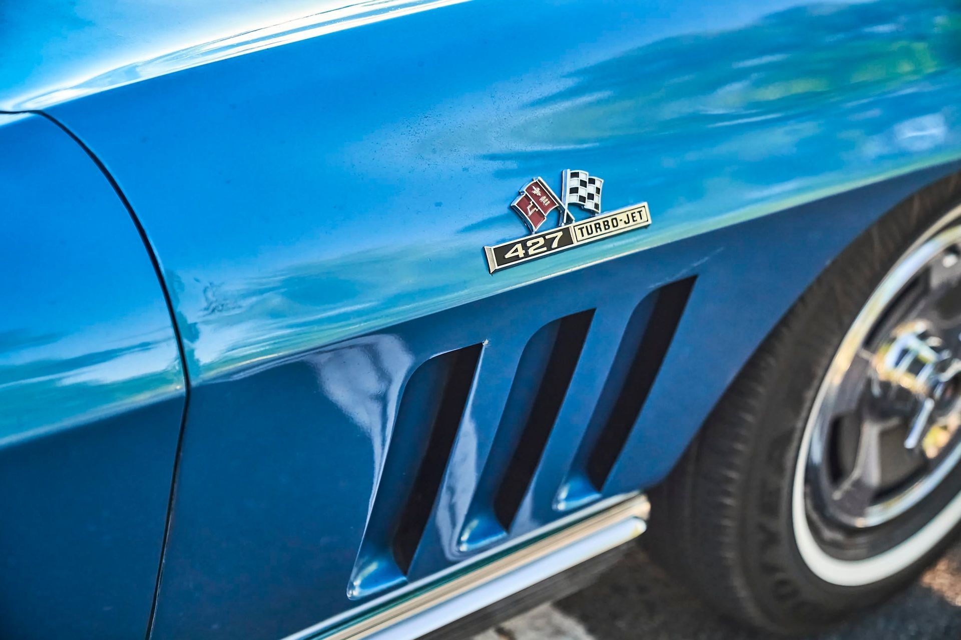 Blue vintage Chevrolet Corvette fender with the 