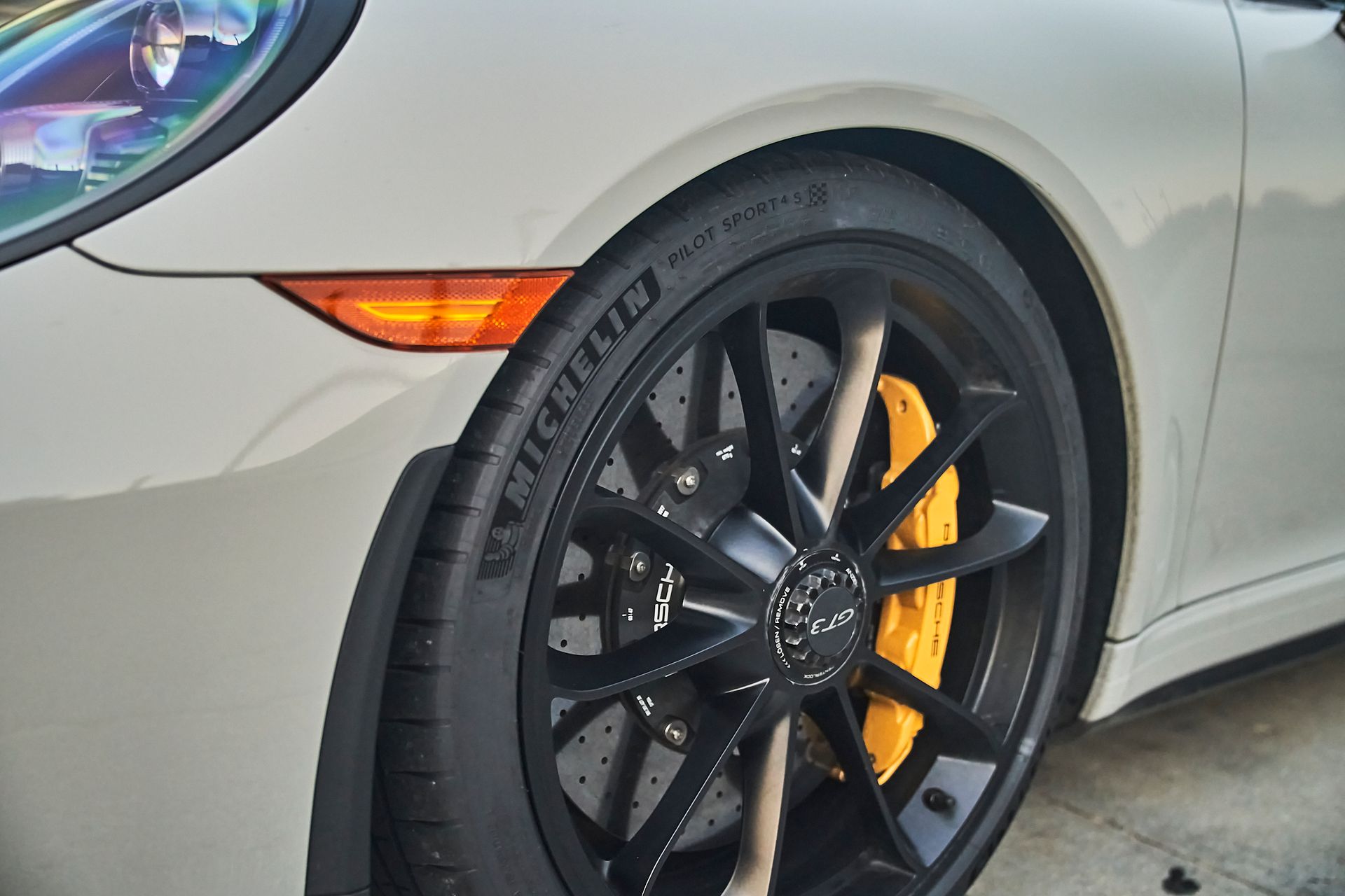A close up of a car wheel with a michelin tire on it.