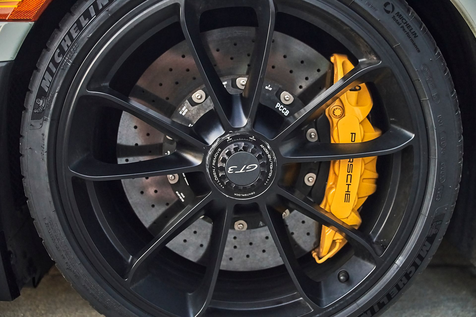 A close up of a michelin tire on a car