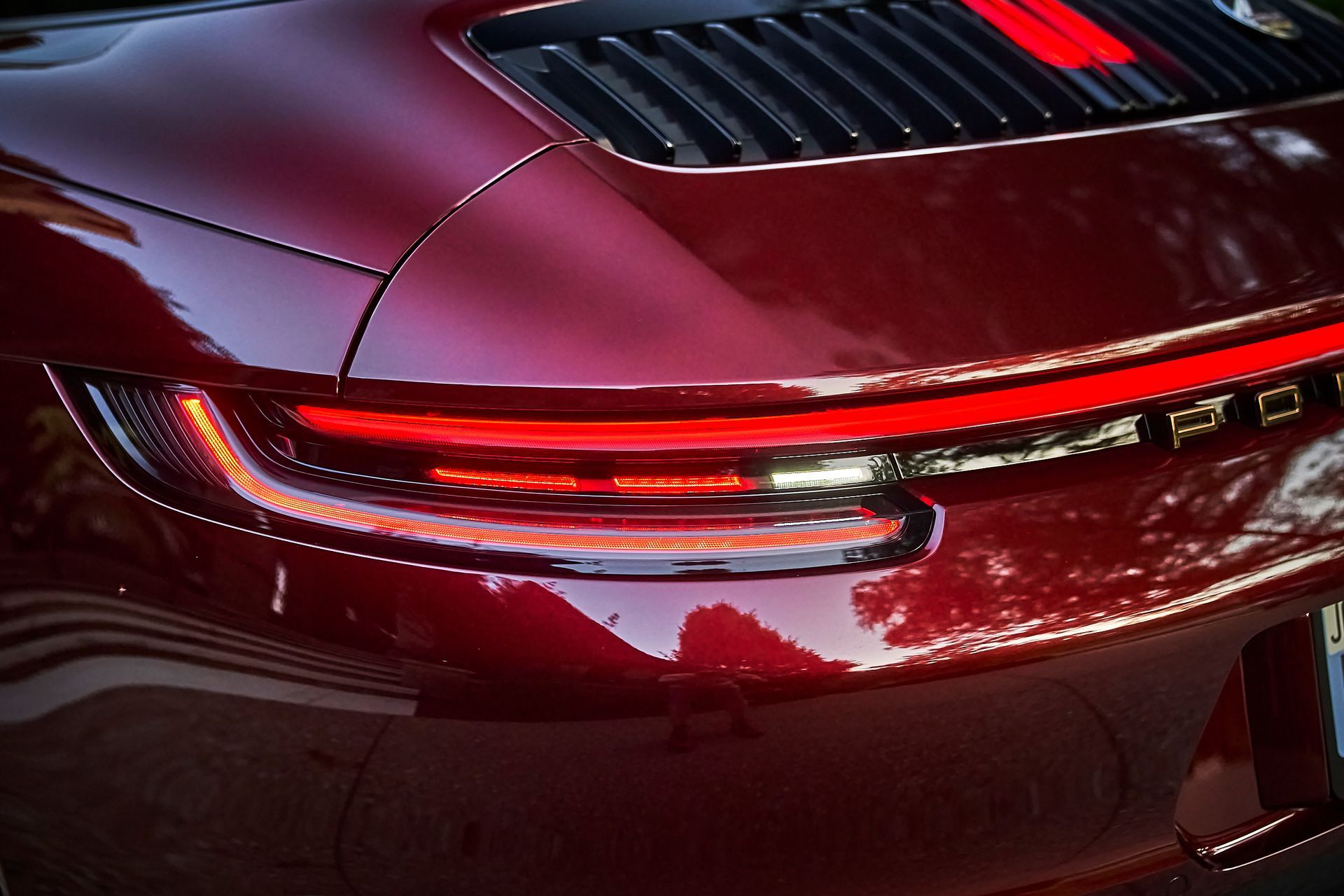 A close up of a red car 's tail light