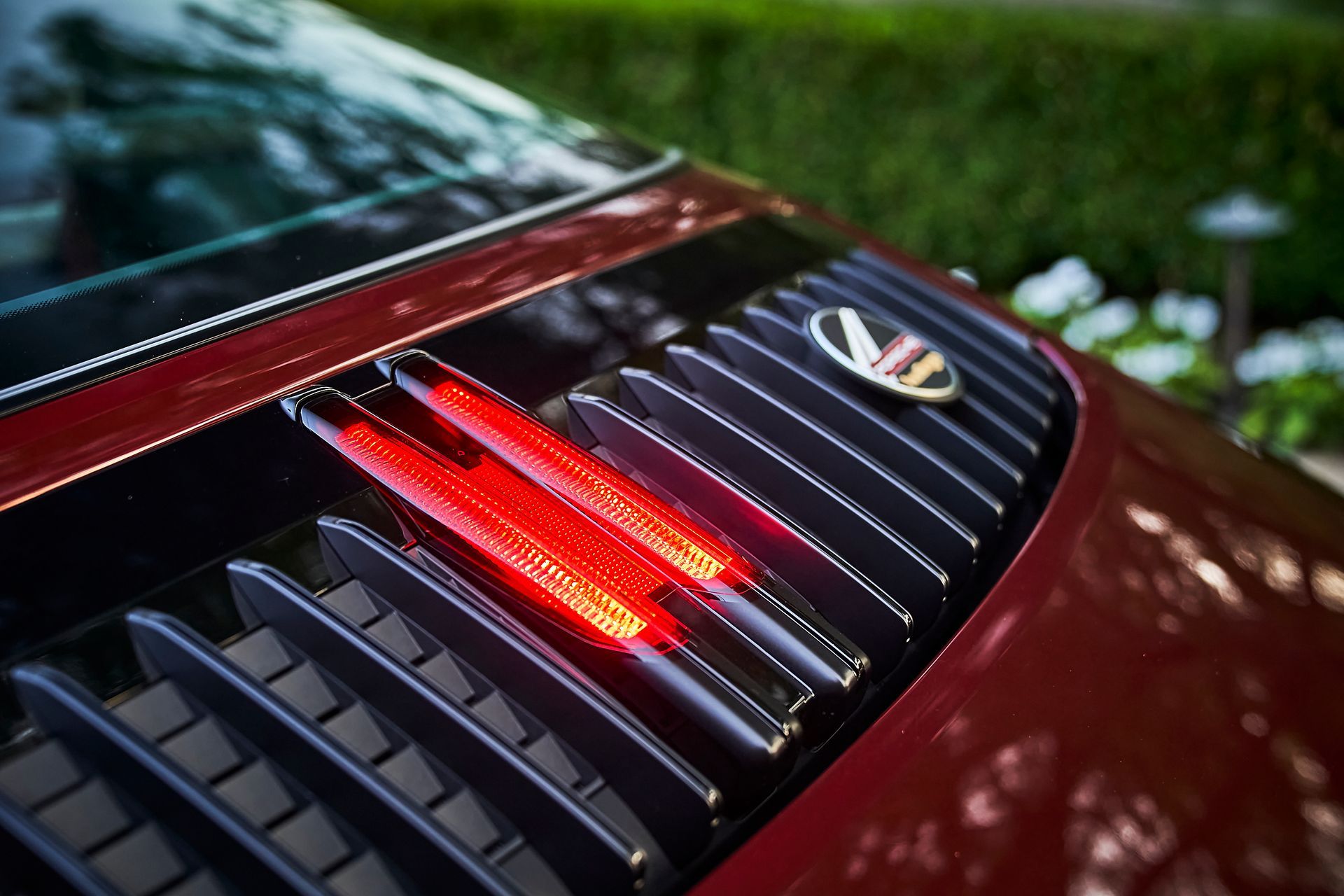 A close up of a red car 's tail light