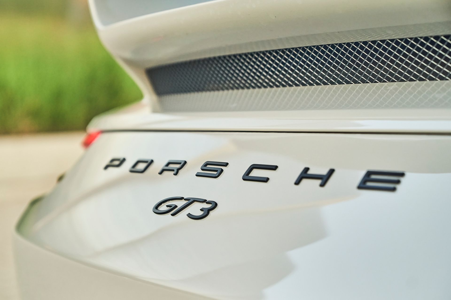 A close up of the back of a porsche gt3