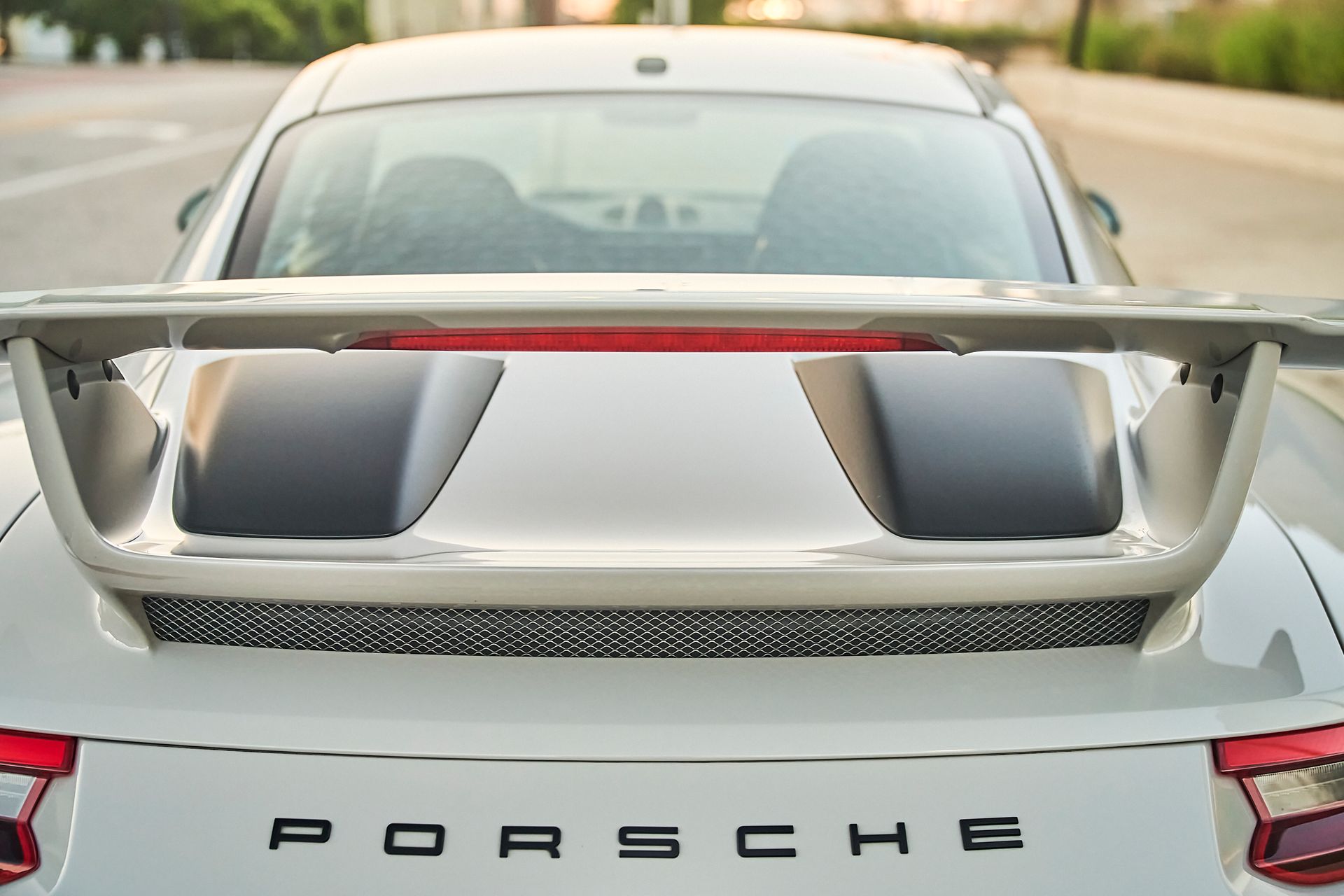 A close up of the rear end of a porsche car