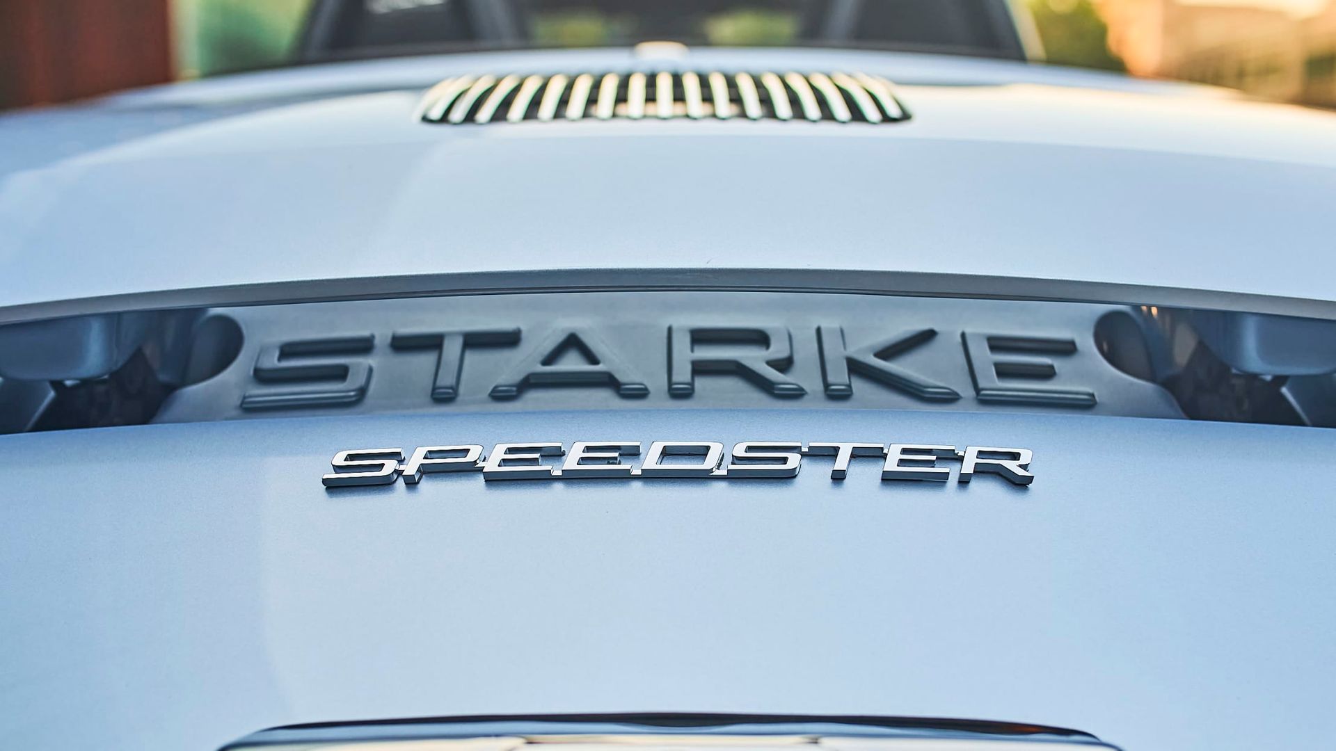 Close-up of a car hood with the black letters