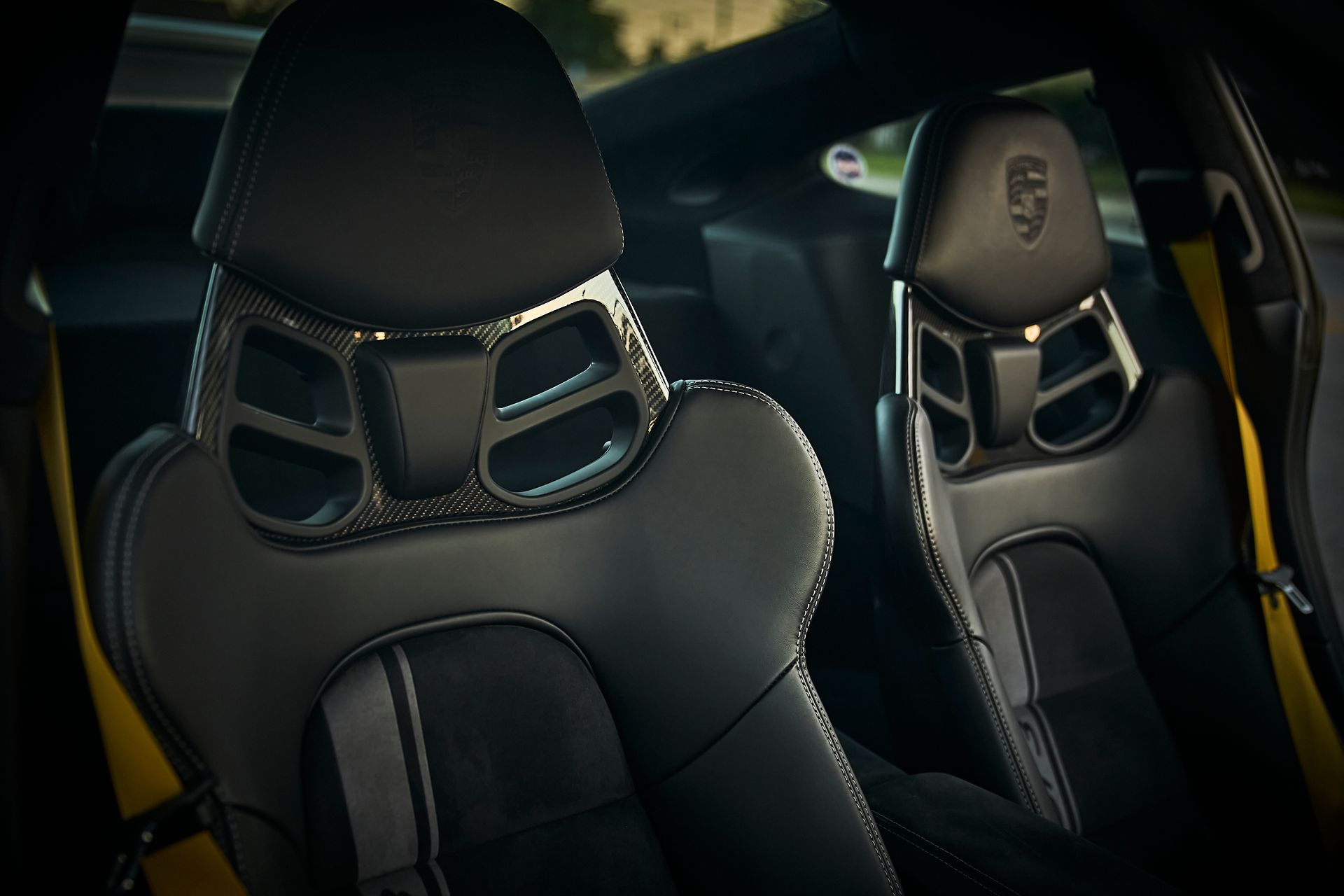 A close up of the seats in a yellow car