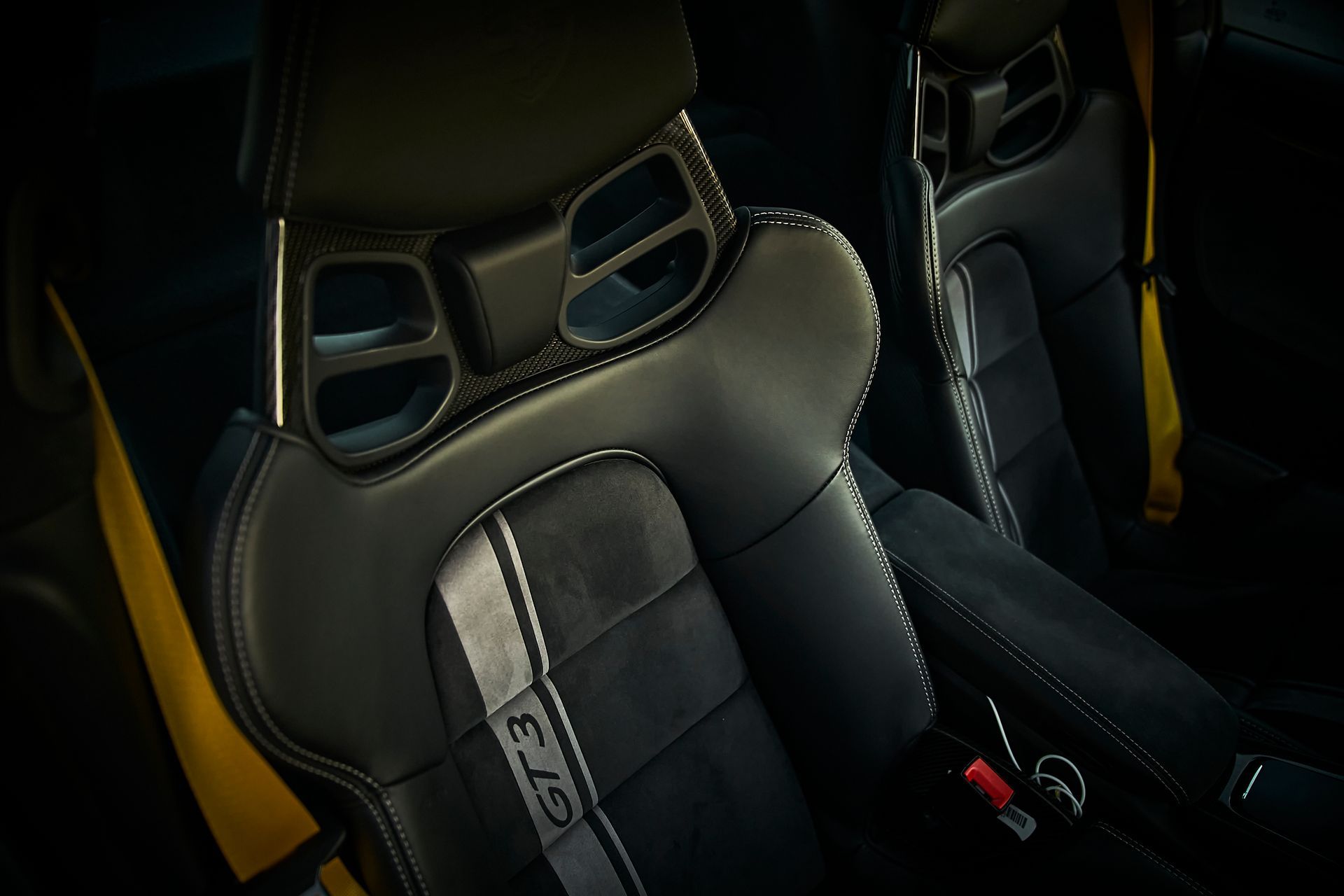 A close up of a car seat with the word gt3 on it