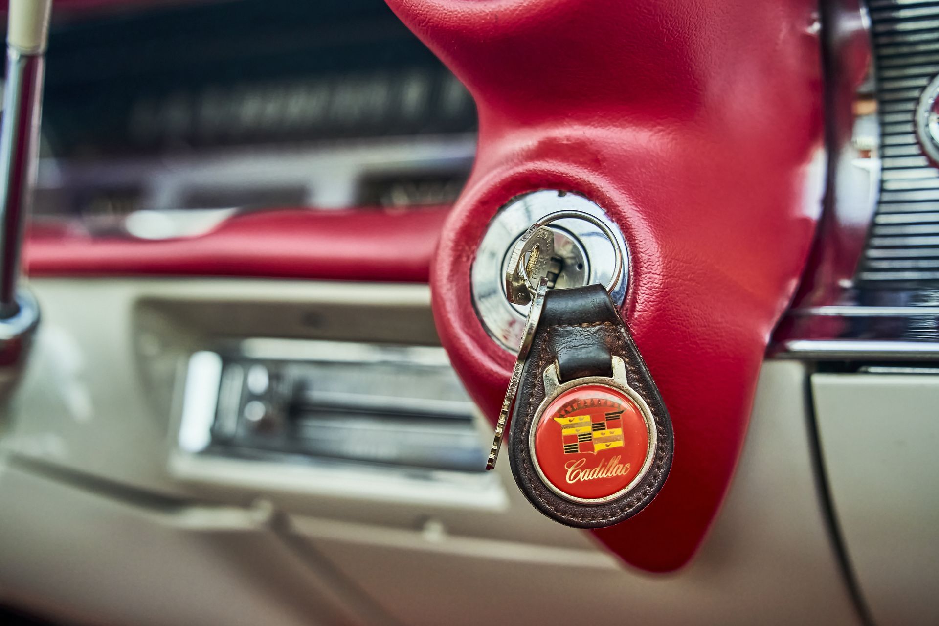A close up of a key in the ignition of a car.