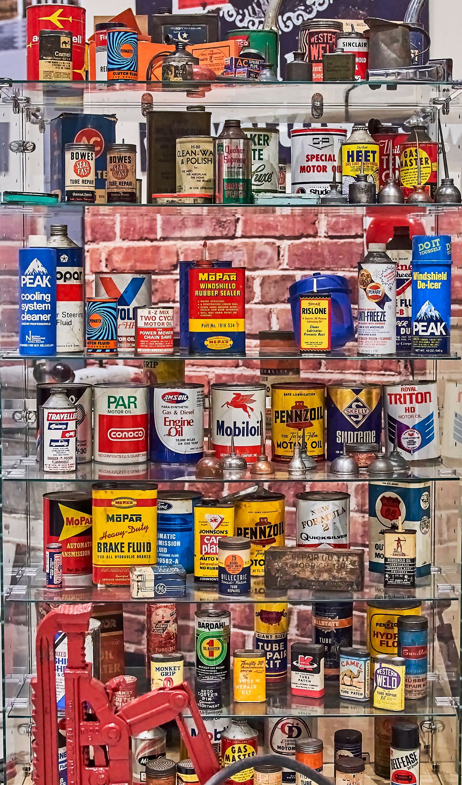 A shelf filled with lots of cans and bottles.