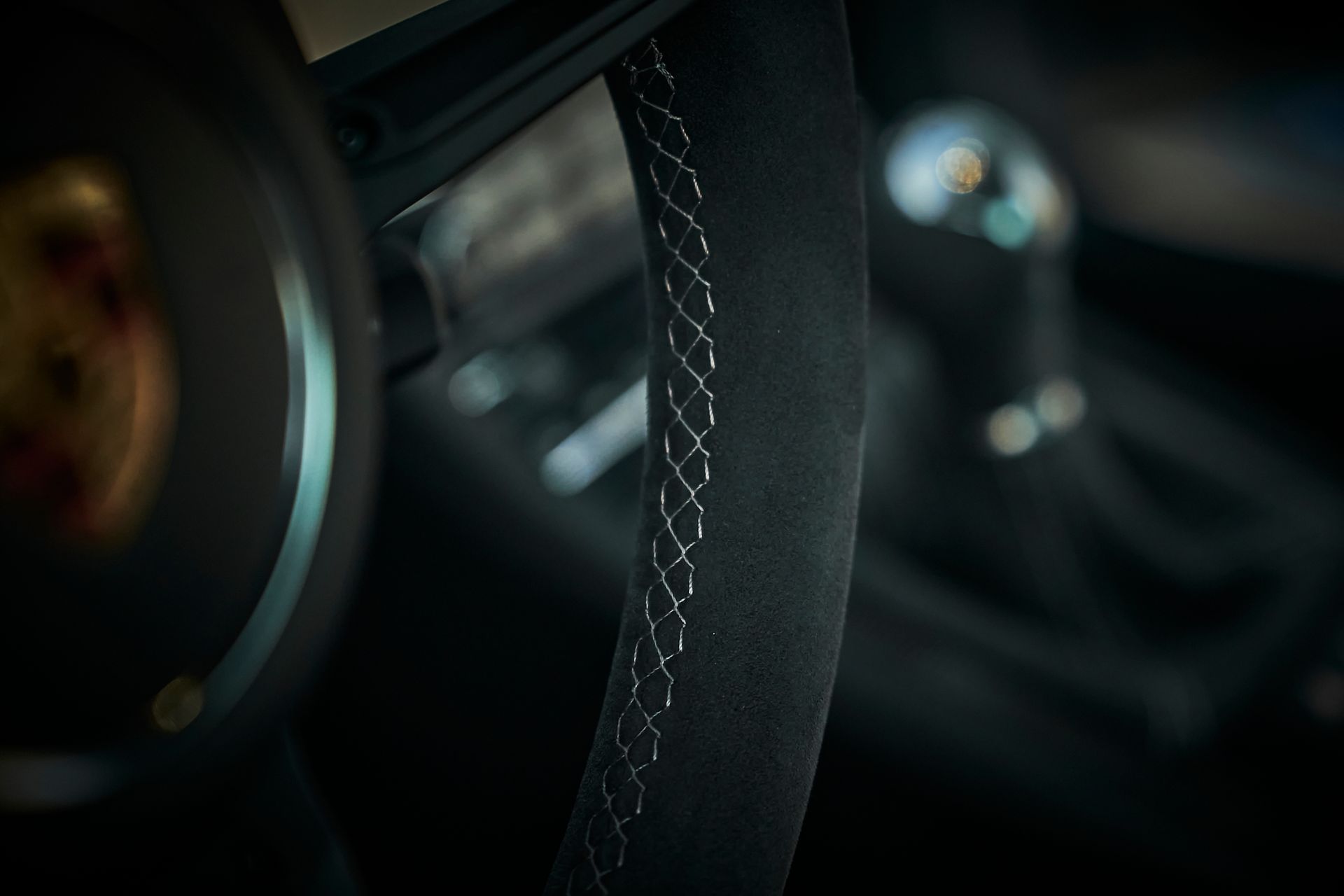 A close up of a steering wheel in a car.