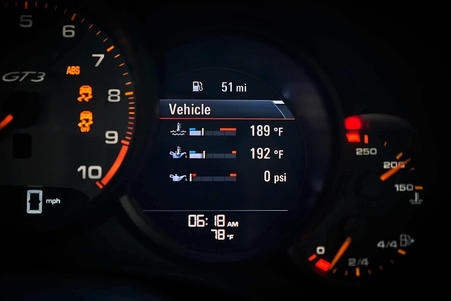 A close up of a car 's dashboard with a vehicle displayed