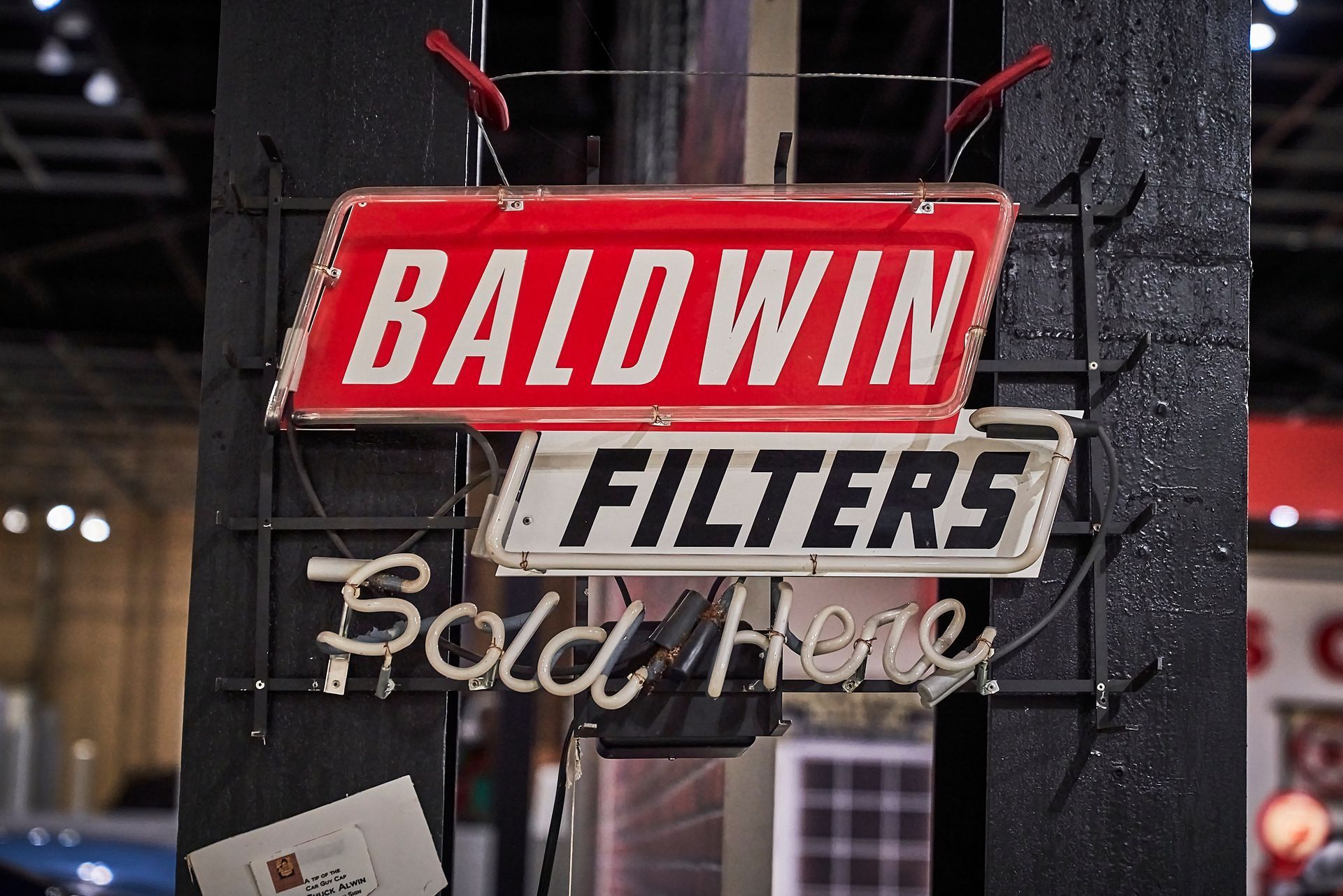 A sign that says baldwin filters sold here